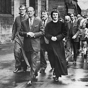 Prince Philip, Duke of Edinburgh, walks with Rev Graham Trasler