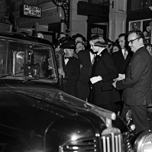 Prince Rainier and Princess Grace of Monaco leave the Apollo Theatre after watching "