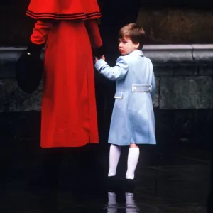 Princess Diana holding Prince William by the hand as they enter St George