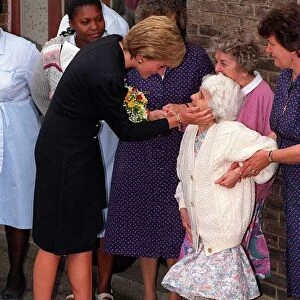 Princess Diana pays a visit to the old folks home run by the Guinness Trust at Newham in