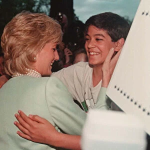 PRINCESS DIANA, WEARING A GREEN JACKET IS GREETED BY DAVID STUDNITZER DURING HER VISIT TO