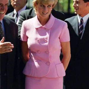 PRINCESS DIANA, WEARING PINK SUIT AND SMILING, GREETING PEOPLE ON HER TRIP TO ARGENTINA