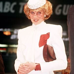 Princess Diana, wearing a white ensemble with red accents