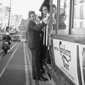 Princess Margaret and Lord Snowdon ride a tram in San Francisco during their visit to