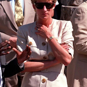PRINCESS OF WALES WEARING SUNGLASSES AND SMILING DURING A VISIT TO RED CROSS CHARITY