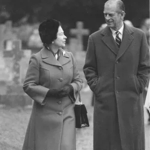 Queen Elizabeth II and Prince Philip walking through Sandringham. February 1986