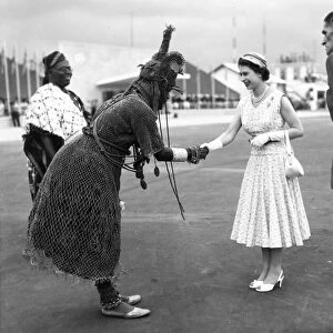Queen Elizabeth II shaking hands with a Nigerian chief during a visit to the country