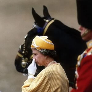 Queen Elizabeth at the Trooping of the Colour on Horse Guards Parade picking her nose