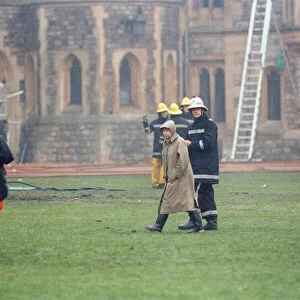The Queen is escorted by the chief fire officer around the grounds of Windsor Castle as
