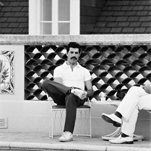 Queen lead singer Freddie Mercury seen here beside the swimming pool at their