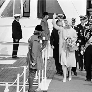 Queen Margrethe of Denmark, accompanied by her husband, Prince Henrik