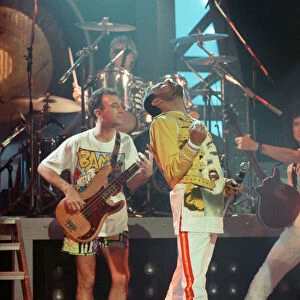 Queen rock group performing. Singer Freddie Mercury with guitarist Brian May
