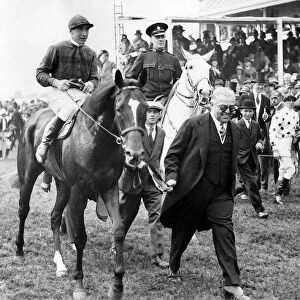 Racehorse Blenheim with jockey Harry Wragg jockey is led by owner the Aga Khan after his