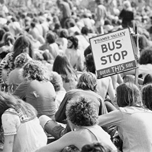 Reading Pop Festival. Festival goers with a Bus Stop sign watching the bands