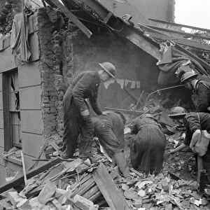 Rescue search in Camden Town after a daylight raid. 1940