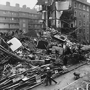 Rescues services search the remains of flats in Shoreditch London after a WW2 air raid