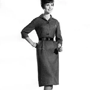 Reveille Fashion. Mannequin wearing a belted mid sleeve dress. January 1961 P006881