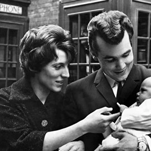 Ricky Valance (David Royston Spencer) with wife Evelyn and baby