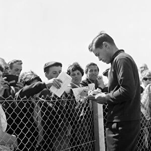 Rider Gary Hocking signs autographs for fans. 4th June 1962