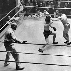 (Right) Brown covering from a left from Lynch during the first round