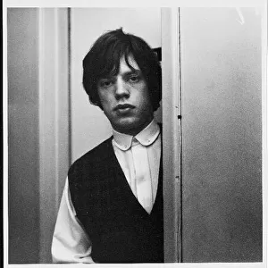 Rolling Stones: Mick Jagger & Brian Jones pose for portraits. Circa January 1964