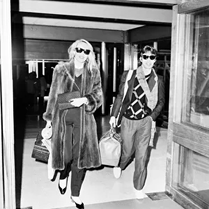 Rolling Stones. Mick Jagger and Jerry Hall leaving London Airport Heathrow for a
