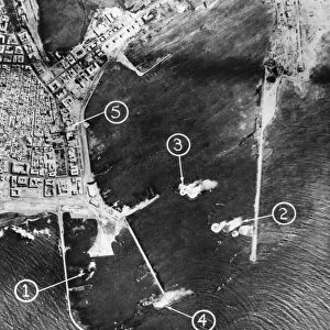 Royal Air Force. Middle East, score direct hits in attack on Benghazi Harbour, Libya
