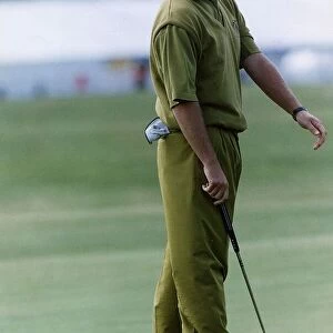 Sandy Lyle golfer holding putter golf club