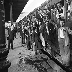 Scenes in Naples, southern Italy showing men arriving at the railway station