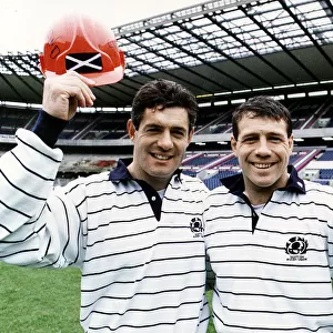 Scott Hastings and Gavin Hastings of the Scotland rugby squad standing in stadium holding