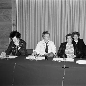 The Sex Pistols. Sid Vicious, Paul Cook, Steve Jones, manager Malcolm McLaren
