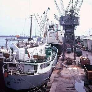 Ships being loaded and unloaded at the port of Luanda in Angola, Africa Circa 1970