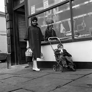 Out shopping in a Bury street is Elsie Tanner (Pat Phoenix