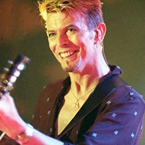 Singer David Bowie July 1997 Playing the guitar live on stage at the Glasgow Barrowlands