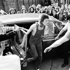 Singer David Bowie as Ziggy Stardust arrives at the stage door of the Odeon in