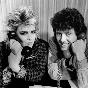 Singers Alvin Stardust and Kim Wilde man the telephones at the television studios 6