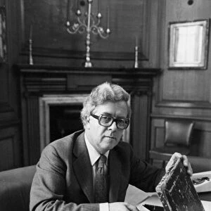 Sir Geoffrey Howe putting speech into budget box in his office at the Treasury - June