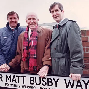 Sir Matt Busby with Alex Ferguson and Martin Edwards standing in Sir Matt Busby Way