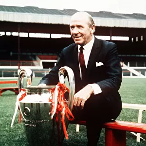 Sir Matt Busby manager of Manchester United poses at a pres season photocall with