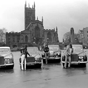 Slade Pop Group pose in front of their Rolls Royce, Daimler and Mercedes cars