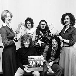 Slade in West Bromwich, with a copy of their new album "