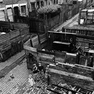 Slum housing in Birmingham. June 1967 Children play amongst the wreckage
