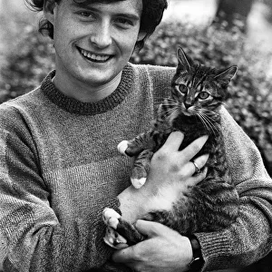 Snooker player Jimmy White with his pet cat Snookes at home in Tooting, South London