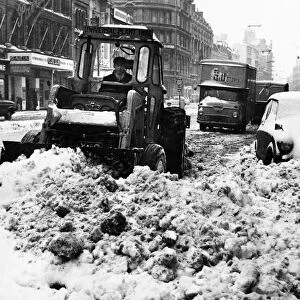 A snowplough busily clearing a path in St Marys Street