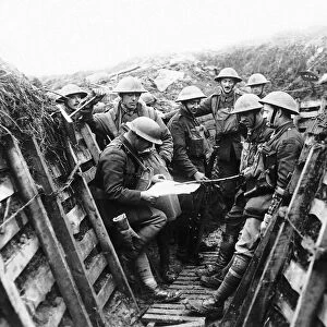 Soldiers from the Kings Liverpool Regiment listening to the news being read out as