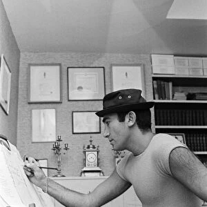 Songwriter and composer Lionel Bart in his flat in South Kensington