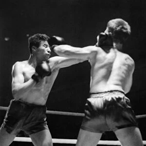 Sport Boxing: Willie Fisher right land a left high on the head of Alf Matthews (left