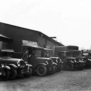 The staff of Uxbridge builders merchants Kirby Brothers pose beside their lorries