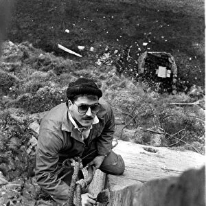Steeplejack David Stone at work on Lindisfarne Castle on 11th November 1988