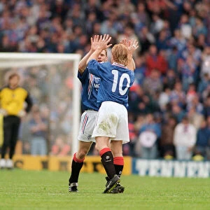 Stuart McCall Rangers football payer gives a Gordon Durie ten after their victory over
